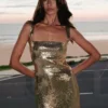 Adoria maxi-jurk met pailletten en uitsnijdingen – Goud Adoria maxi-jurk met pailletten en uitsnijdingen – Goud