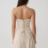 Annie strapless linnen top met strik aan de achterkant – Natuur Annie strapless linnen top met strik aan de achterkant – Natuur