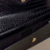 Jessica kunstleren krokodillenclutch – zwart Jessica kunstleren krokodillenclutch – zwart