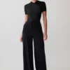 Junie bodysuit met korte mouwen en gekruiste hals – Zwart Junie bodysuit met korte mouwen en gekruiste hals – Zwart