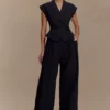 Raya linnen broek met middelhoge taille en wijde pijpen – Zwart Raya linnen broek met middelhoge taille en wijde pijpen – Zwart