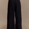 Raya linnen broek met middelhoge taille en wijde pijpen – Zwart Raya linnen broek met middelhoge taille en wijde pijpen – Zwart