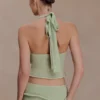 Samira gebreide haltertop met draai – pastelgroen Samira gebreide haltertop met draai – pastelgroen