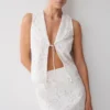 Tessa Broderie mouwloze top met strik aan de voorkant – Wit Tessa Broderie mouwloze top met strik aan de voorkant – Wit