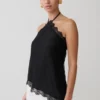 Theodosia asymmetrische haltertop met kant – Zwart Theodosia asymmetrische haltertop met kant – Zwart